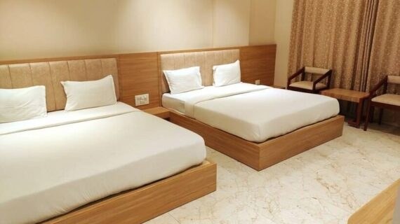 Four bed room with two double beds at Maharashtra Bhuvan Jain Dharmshala